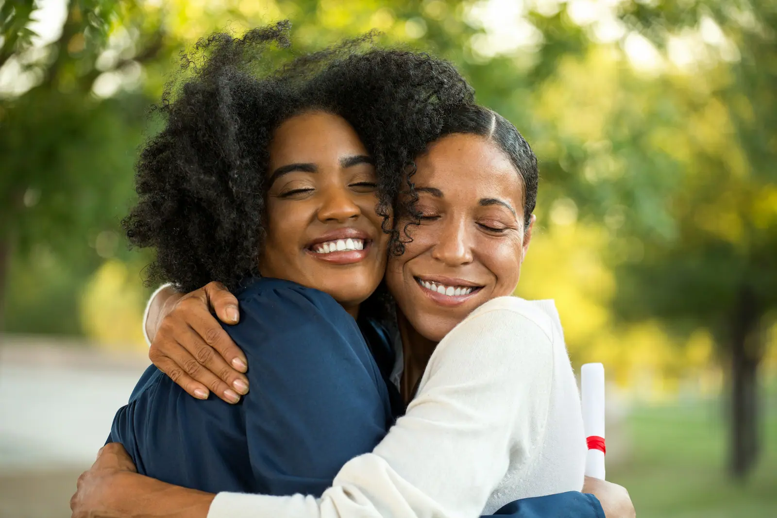 Two women embracing and smiling at Waukegan Community Church
